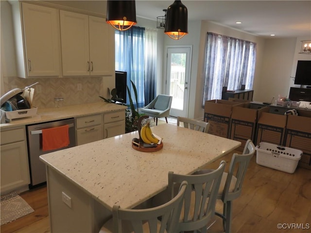 7617 Royal Crown Ct, Mechanicsville, VA 23116 - kitchen featuring dishwasher, light wood-type flooring, white cabinets, open floor plan, and decorative backsplash