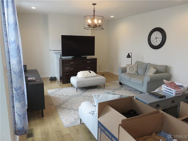 7617 Royal Crown Ct, Mechanicsville, VA 23116 - living room with a chandelier, light wood finished floors, recessed lighting, and baseboards