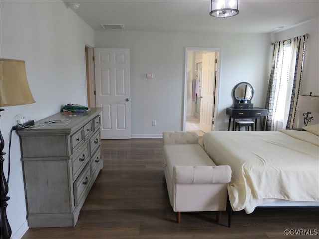 7617 Royal Crown Ct, Mechanicsville, VA 23116 - bedroom with dark wood-style floors, ensuite bathroom, and baseboards