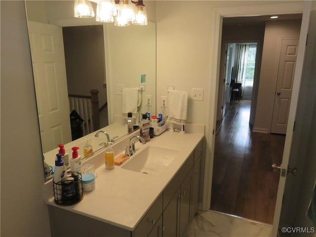 7617 Royal Crown Ct, Mechanicsville, VA 23116 - bathroom featuring vanity, wood finished floors, and a chandelier