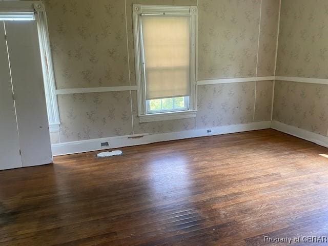 2784 Kings Creek Rd, Hayes, VA 23072 - spare room with wallpapered walls and wood finished floors