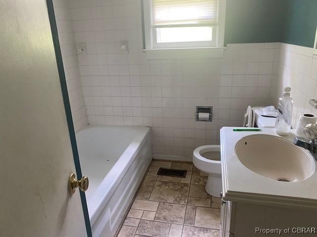 2784 Kings Creek Rd, Hayes, VA 23072 - full bath with a bath, tile walls, toilet, and vanity