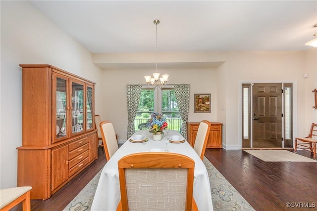 17231 Ivory Bill Ln, Chesterfield, VA 23838 - dining area featuring dark wood-style floors, a chandelier, and baseboards