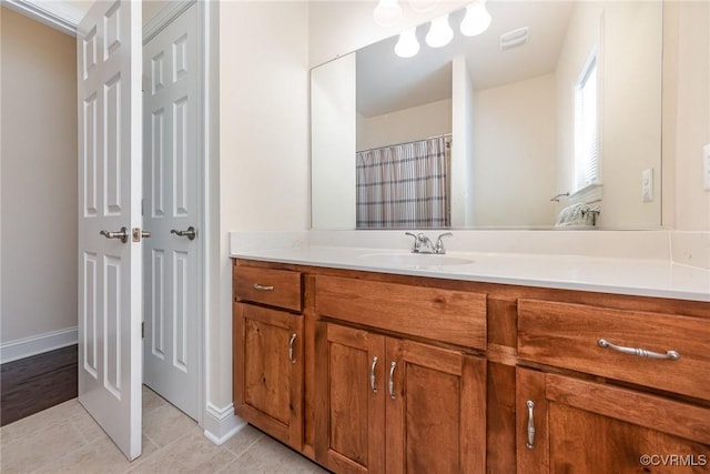 17231 Ivory Bill Ln, Chesterfield, VA 23838 - bathroom featuring vanity, tile patterned flooring, and baseboards