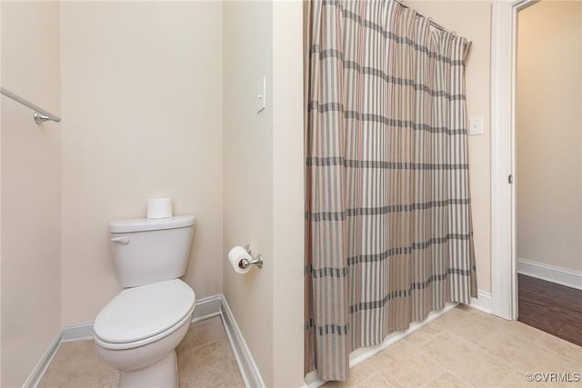 17231 Ivory Bill Ln, Chesterfield, VA 23838 - bathroom with toilet, a shower with shower curtain, baseboards, and tile patterned floors