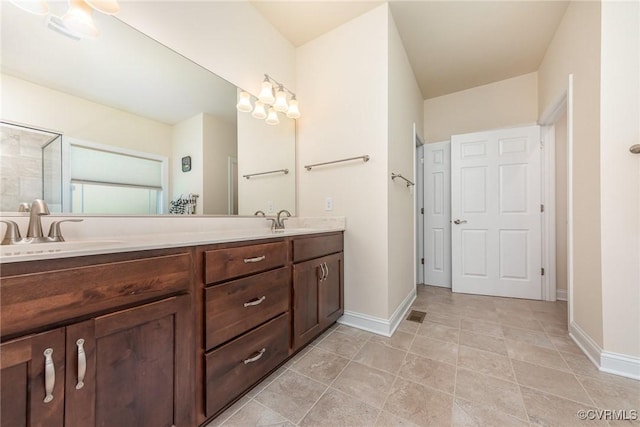 17231 Ivory Bill Ln, Chesterfield, VA 23838 - full bathroom featuring double vanity, baseboards, and a shower