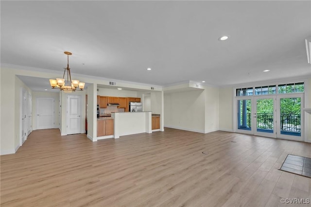4250 Granby St Unit 105, Norfolk, VA 23504 - unfurnished living room with a chandelier, light wood-type flooring, recessed lighting, baseboards, and crown molding