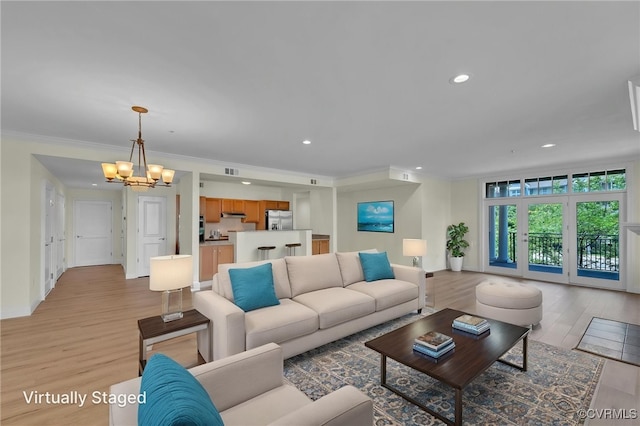 4250 Granby St Unit 105, Norfolk, VA 23504 - living room featuring a chandelier, light wood-type flooring, recessed lighting, baseboards, and crown molding