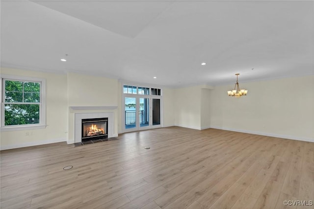 4250 Granby St Unit 105, Norfolk, VA 23504 - unfurnished living room featuring a chandelier, a fireplace, light wood-style floors, baseboards, and recessed lighting