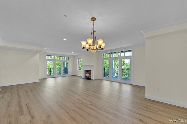 4250 Granby St Unit 105, Norfolk, VA 23504 - unfurnished living room featuring a chandelier, baseboards, recessed lighting, light wood-style floors, and a fireplace with flush hearth