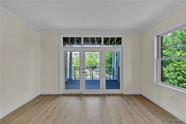 4250 Granby St Unit 105, Norfolk, VA 23504 - spare room with healthy amount of natural light, light wood finished floors, ornamental molding, and baseboards
