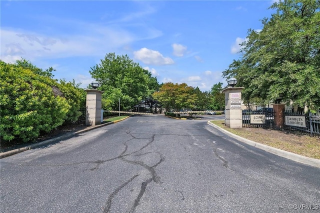 4250 Granby St Unit 105, Norfolk, VA 23504 - view of asphalt road featuring curbs, street lights, and a gated entry