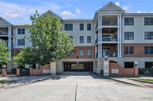 4250 Granby St Unit 105, Norfolk, VA 23504 - view of building exterior with an attached garage and concrete driveway