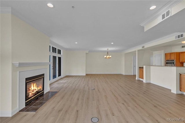 4250 Granby St Unit 105, Norfolk, VA 23504 - unfurnished living room featuring a chandelier, a fireplace, light wood-type flooring, baseboards, and recessed lighting