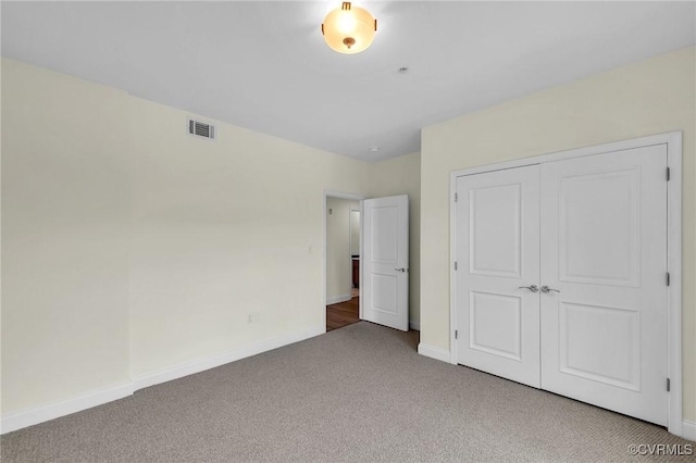 4250 Granby St Unit 105, Norfolk, VA 23504 - unfurnished bedroom featuring carpet floors, baseboards, and a closet