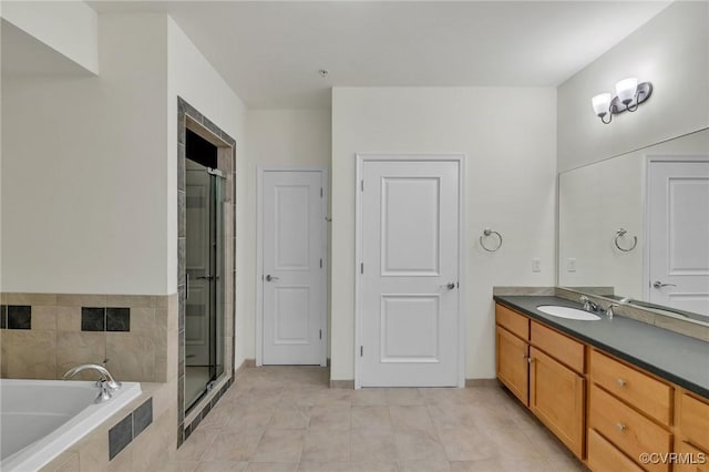 4250 Granby St Unit 105, Norfolk, VA 23504 - bathroom featuring vanity, a stall shower, a garden tub, and tile patterned flooring