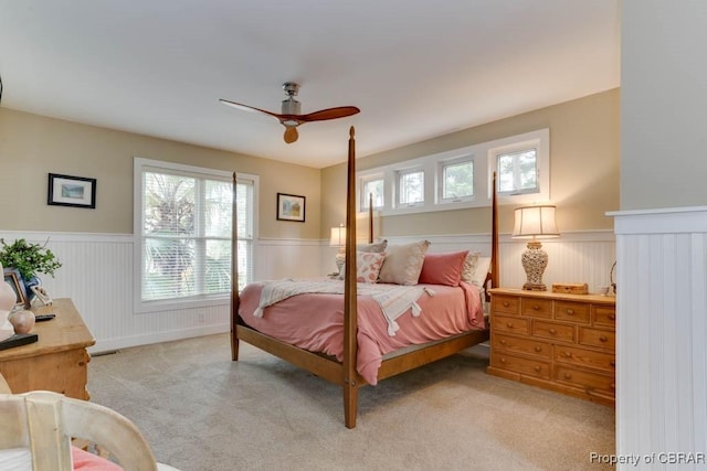 109 Vreeland Dr, Yorktown, VA 23692 - bedroom with wainscoting, light carpet, and a ceiling fan
