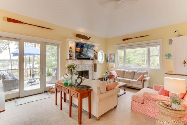 109 Vreeland Dr, Yorktown, VA 23692 - living area featuring a fireplace, high vaulted ceiling, and light carpet