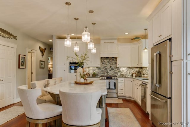 109 Vreeland Dr, Yorktown, VA 23692 - kitchen featuring appliances with stainless steel finishes, dark wood-style flooring, decorative backsplash, white cabinetry, and recessed lighting