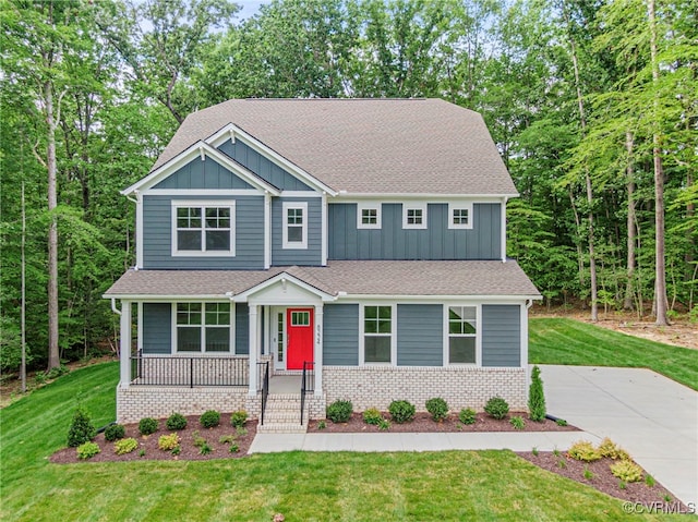 16831 Barmer Rd, Chesterfield, VA 23838 - craftsman-style house featuring board and batten siding, a porch, a shingled roof, and a front lawn