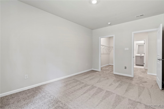 16831 Barmer Rd, Chesterfield, VA 23838 - unfurnished bedroom featuring carpet, a walk in closet, baseboards, and a closet
