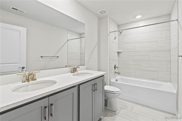 16831 Barmer Rd, Chesterfield, VA 23838 - bathroom with toilet, double vanity, shower / bathtub combination, and recessed lighting