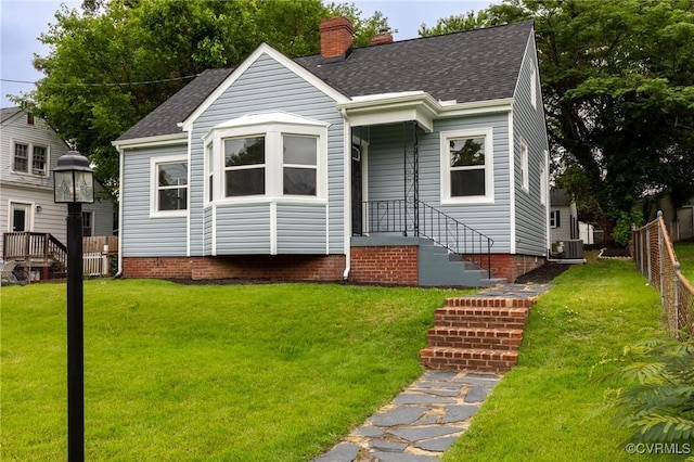 2214 Parkside Ave, Henrico, VA 23228 - view of front of house with a shingled roof, cooling unit, and a chimney