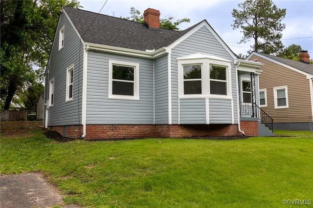 2214 Parkside Ave, Henrico, VA 23228 - view of front of home with a chimney, a front lawn, and roof with shingles