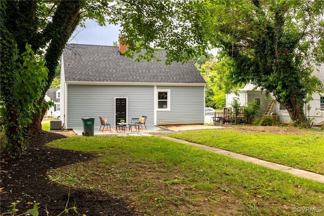 2214 Parkside Ave, Henrico, VA 23228 - back of property with a patio, central air condition unit, a chimney, a yard, and a shingled roof