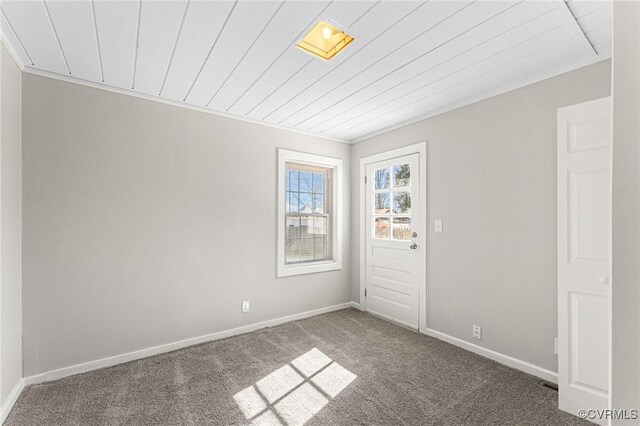 109 E Maryland Ave, Crewe, VA 23930 - carpeted empty room featuring baseboards and wooden ceiling