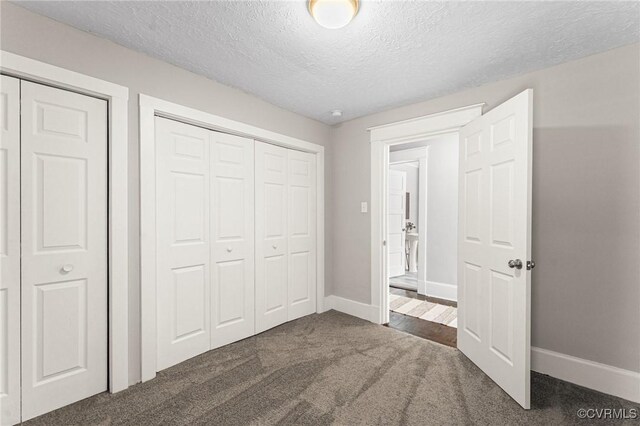 109 E Maryland Ave, Crewe, VA 23930 - unfurnished bedroom featuring carpet floors, baseboards, a textured ceiling, and a closet