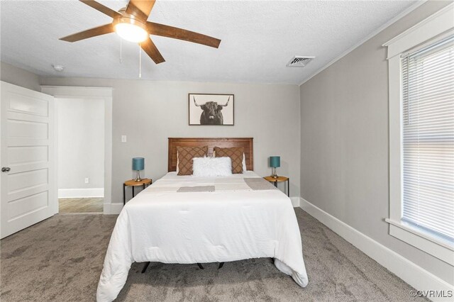 109 E Maryland Ave, Crewe, VA 23930 - bedroom featuring carpet, a textured ceiling, a ceiling fan, and baseboards