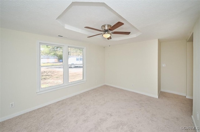 10486 Malboro Rd, Hanover, VA 23116 - unfurnished room with a textured ceiling, light carpet, ceiling fan, a raised ceiling, and baseboards