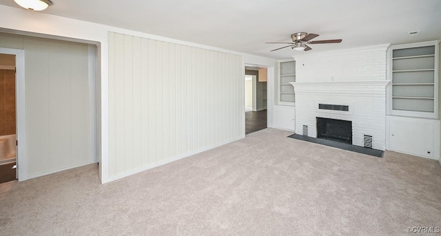 10486 Malboro Rd, Hanover, VA 23116 - unfurnished living room with a ceiling fan, carpet, built in shelves, and a fireplace
