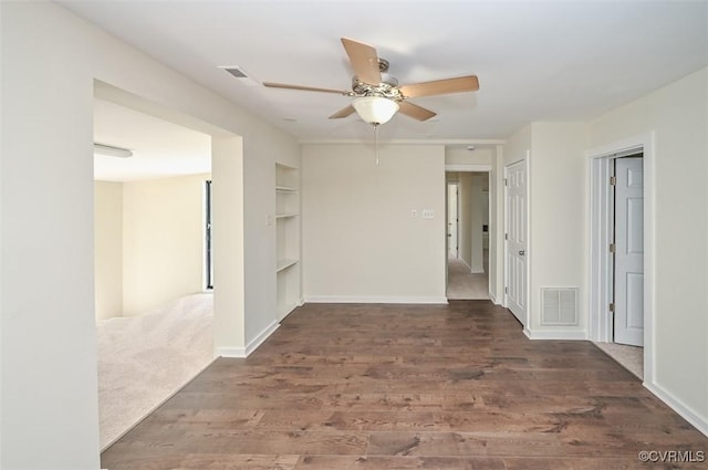 10486 Malboro Rd, Hanover, VA 23116 - spare room featuring wood finished floors, built in features, ceiling fan, and baseboards