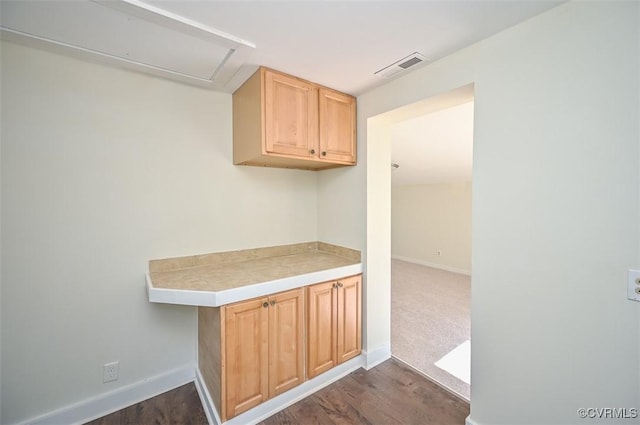 10486 Malboro Rd, Hanover, VA 23116 - kitchen with baseboards, dark wood-style flooring, and light brown cabinets