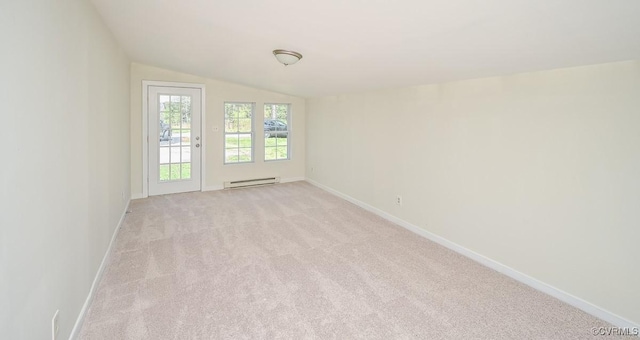 10486 Malboro Rd, Hanover, VA 23116 - empty room with baseboard heating, light colored carpet, vaulted ceiling, and baseboards