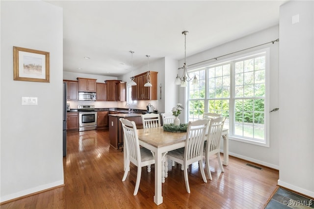 14300 Wallingham Loop, Midlothian, VA 23114 - dining room with baseboards and hardwood / wood-style floors