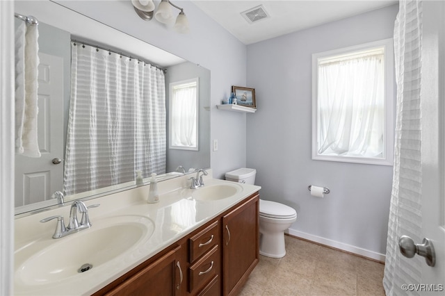 14300 Wallingham Loop, Midlothian, VA 23114 - bathroom with toilet, healthy amount of natural light, double vanity, and baseboards