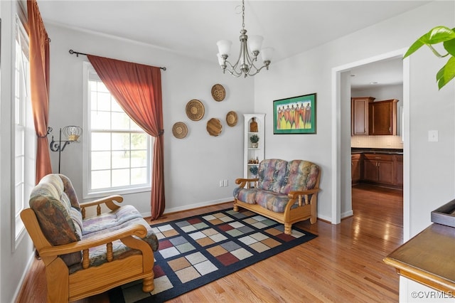14300 Wallingham Loop, Midlothian, VA 23114 - living area with light wood-type flooring, a chandelier, and baseboards