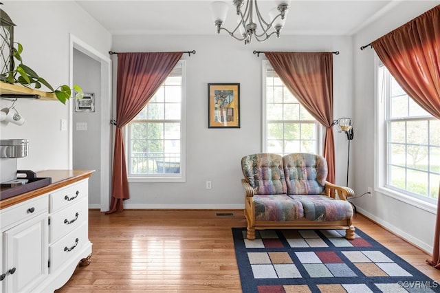 14300 Wallingham Loop, Midlothian, VA 23114 - living area with plenty of natural light, a chandelier, and light wood finished floors