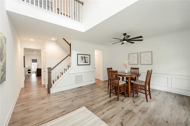 720 Chapman St, Ashland, VA 23005 - dining space featuring stairway, wood finished floors, a ceiling fan, a decorative wall, and recessed lighting