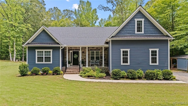 1535 Ole Bert Dr, Powhatan, VA 23139 - view of front facade with covered porch, a front yard, and roof with shingles