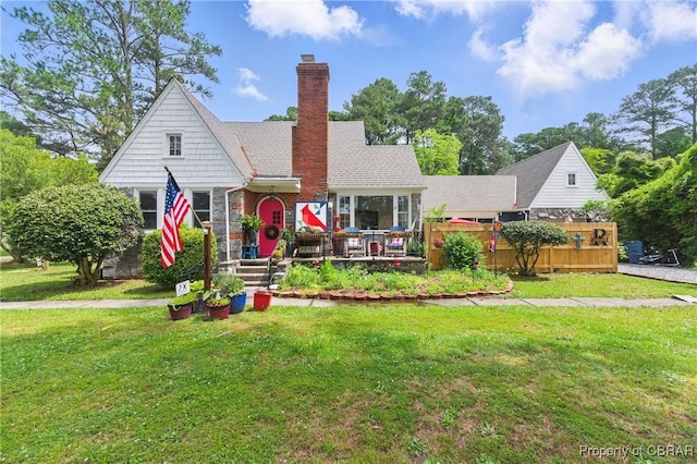 290 Circle Dr, Port Haywood, VA 23138 - view of front of home with a front lawn, a chimney, and a deck
