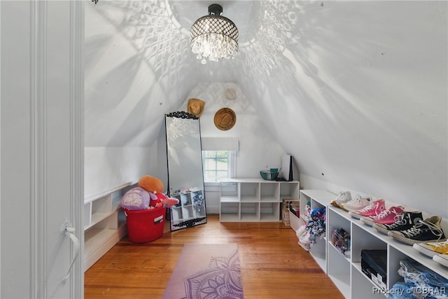 290 Circle Dr, Port Haywood, VA 23138 - game room with lofted ceiling, wood finished floors, and a chandelier