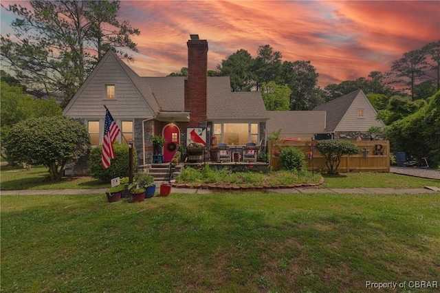290 Circle Dr, Port Haywood, VA 23138 - view of front of house with a lawn and a chimney