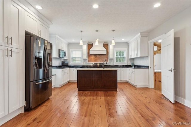 29898 The Trl, Shacklefords, VA 23110 - kitchen with stainless steel appliances, premium range hood, light wood-style floors, plenty of natural light, and recessed lighting