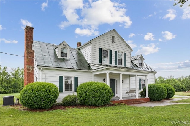 29898 The Trl, Shacklefords, VA 23110 - view of front of property featuring a chimney, covered porch, a front lawn, a standing seam roof, and metal roof