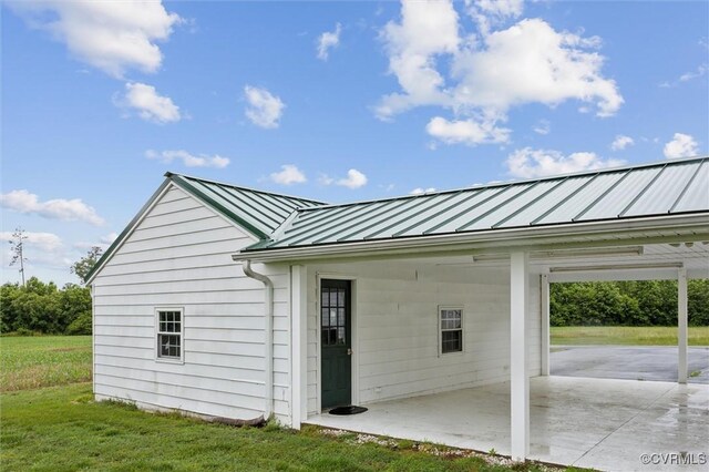 29898 The Trl, Shacklefords, VA 23110 - garage featuring an attached carport