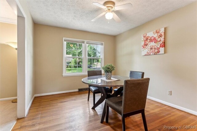 1 Beacon Cir, Hampton, VA 23664 - dining area with a textured ceiling, baseboards, light wood finished floors, and a ceiling fan